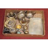 A box of miscellaneous metalwares to include a four piece tea service of half fluted form