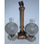 A pair of cut clear glass oil lamp fonts with Hinks Duplex burner and globular shades, together with