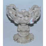 An alabaster boat shaped table centrepiece carved with flowers, height 31cm