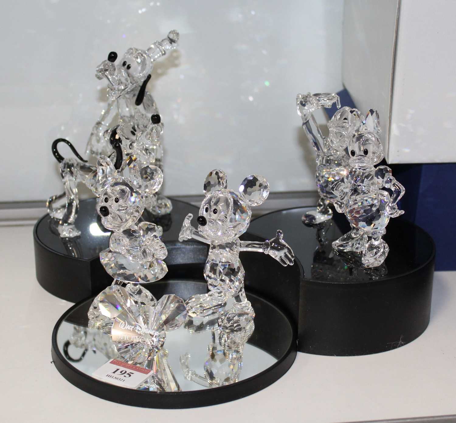 A set of six Swarovski Disney Showcase crystal ornaments to include Mickey & Minnie Mouse, Pluto,