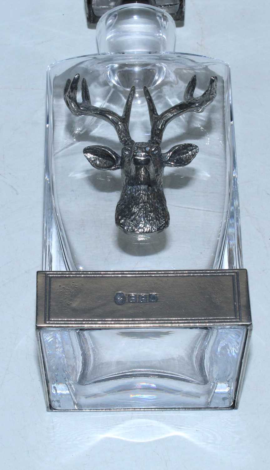 An English Pewter Company glass decanter mounted with a pewter stag's head with a further pewter - Image 2 of 2