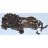 A reproduction bronzed metal figure of a lion, length 32cm