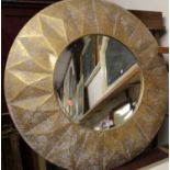 A circular bevelled wall mirror, in aged and gold-sprayed deep frame, dia.83cm