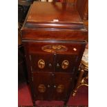 An early 20th century mahogany and floral polychrome decorated gramophone cabinet, having hinged