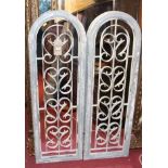 A pair of contemporary French style grey painted arched wall mirrors, each with inset white