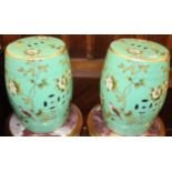 A pair of Chinese style floral painted ceramic barrel seats, each height 45cmCondition report: