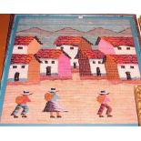 A large felt work study depicting children before a row of houses, 90 x 90cm, in glazed frame