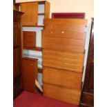 An extensive arrangement of Tapley teak modular wall furniture, to include; three drawer chest