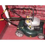 A petrol driven lawn-mower, 173cc (not currently running according to information provided by