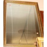 A modern gilt framed and bevelled rectangular wall mirror, 100 x 70cm