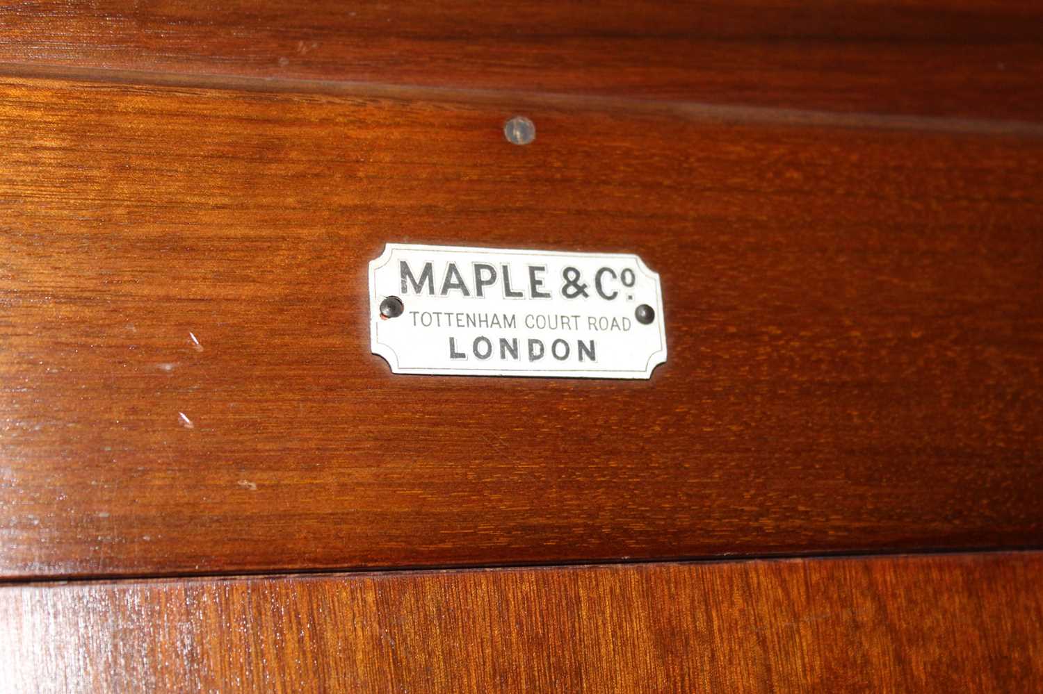 An Edwardian walnut compactum wardrobe by Maple & Co., having single mirror door, twin cupboard - Image 7 of 7
