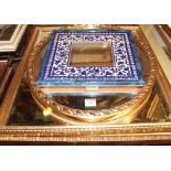 Three various modern gilt framed and bevelled wall mirrors, the largest 60 x 50cm; and an Isnik