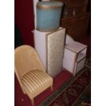 A Lloyd Loom wicker nursing chair; together with a Lloyd Loom laundry box; and three further