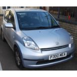 A Daihatsu Sirion 1.3 hatchback, metallic silver finish, 61,360 miles, private registration P300