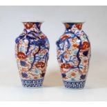 A pair of early 20th century vases, each of baluster form, decorated in the Imari palette, further