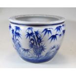A large reproduction blue and white jardinière, decorated with birds amidst flowering bamboo, dia.