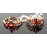 A yellow metal and heart shaped garnet set dress ring, stamped 9ct and 375, 1.4g; together with a