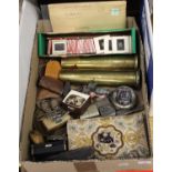 A box of miscellaneous items, to include a pair of brass shell cases, pocket cigarette lighters,