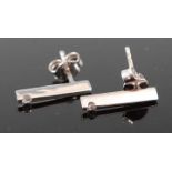 A pair of contemporary 18ct white gold diamond set ear studs, 2g, 16mm