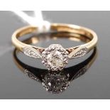 An 18ct gold and platinum diamond solitaire ring, the illusion set brilliant weighing approx 0.12