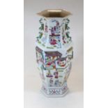 A reproduction Chinese style vase, of hexagonal baluster form, typically decorated with figures