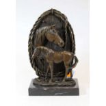 A modern bronze figure group of a horse and foal, within a ropetwist border and on marble plinth,