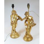 A pair of modern gilt painted table lamps, each in the form of a Cupid, h.48cm (including fittings)
