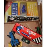 A box containing a small collection of diecast model vehicles to include a Corgi Jaguar XJ3
