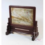 A Chinese table screen, the hardstone panel with Chinese script within a pierced hardwood stand, w.