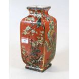 A modern Chinese vase, of square section, on a red ground, enamel decorated with birds amidst