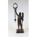 A modern bronzed mystery clock in the form of a pilot with propeller in hand, h.39cm