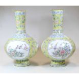 A pair of continental enamel vases, each having a slender neck to a bulbous lower body and