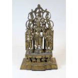 A Tibetan style gilt bronze figure group, in the form of three deities, in standing pose against