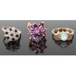 A contemporary 9ct gold, blue and white stone set flower head cluster ring; together with a 9ct gold