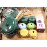 A graduated set of three Le Creuset green enamelled saucepans and covers; together with a single