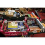 Five boxes containing a collection of various diecast model vehicles, games, puzzles, DVDs and