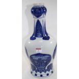 A large Chinese blue & white vase having an onion top to a slender neck and bulbous lower body,