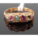A vintage lady's 15ct gold multi-stone ring, set with alternating amethyst and emerald (one