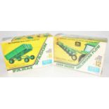 A group of two boxed Ertl farm kits as follows: John Deere Moldboard plow (still sealed) and a