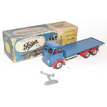 A Shackleton Toys clockwork model of a Foden FG flat bed truck comprising of dark blue cab and