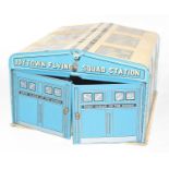 A Mettoy Joytown Flying Squad tinplate police station comprising of blue, cream and black detailed