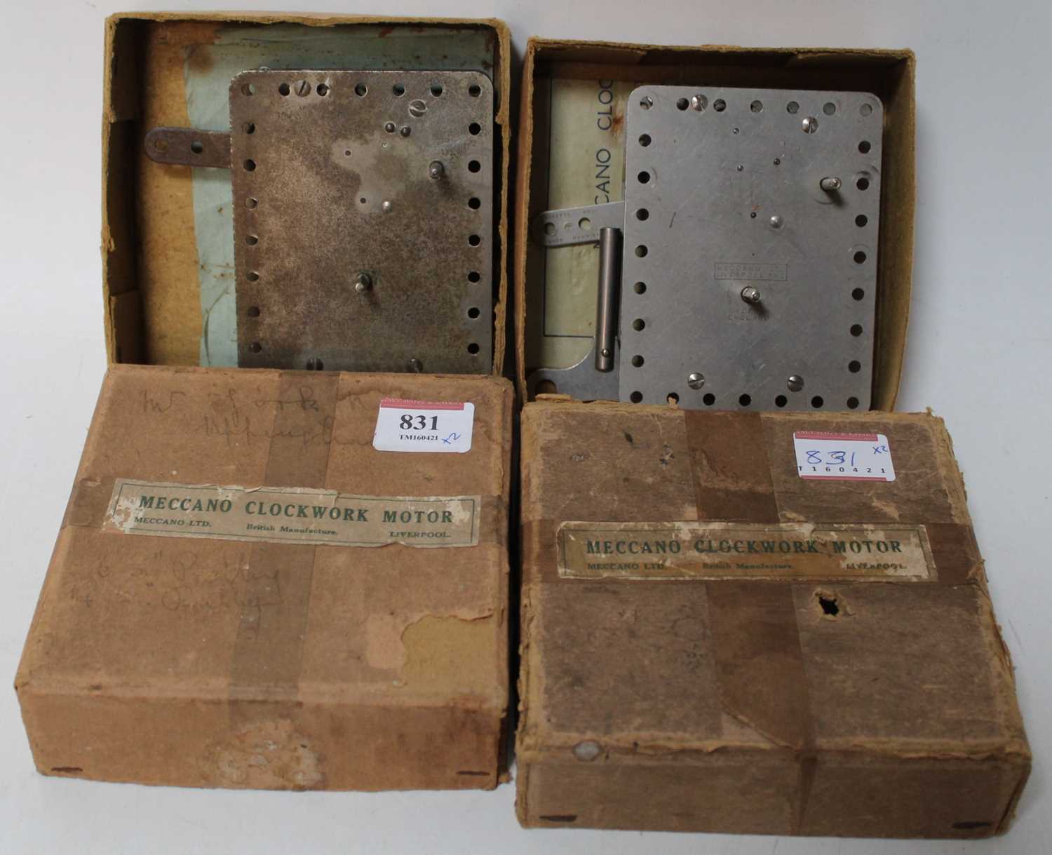 Two very early Meccano No. 1 clockwork motors, nickel in original boxes, with keys and guarantees