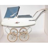 Triang dolls pram, circa mid 1960s in good condition for age, complete with original cover and hood.