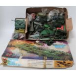 A group of plastic military models unboxed loose items,which include some Triang trucks and a Airfix