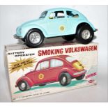 An Aoshin tinplate and battery operated model of a Smoking Volkswagen finished in light blue with