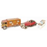 A collection of tinplate mixed commercial and saloons to include a Mettoy No. 15546 Royal Mail