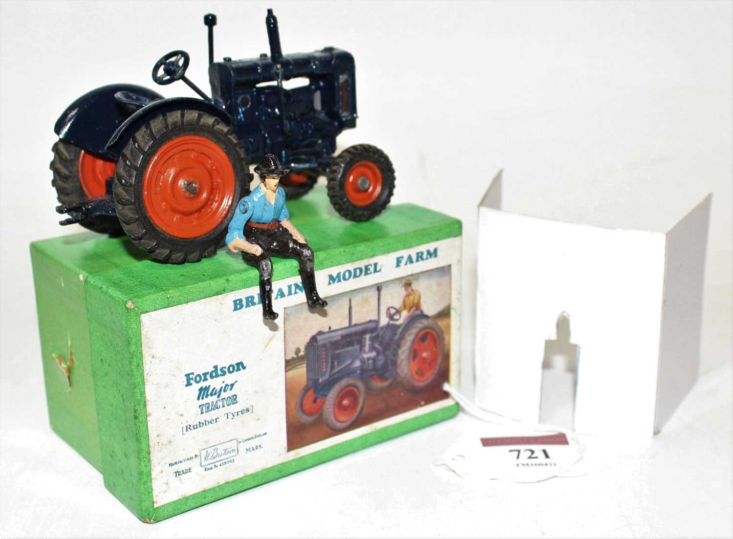 A Britains model No. 128F Fordson Major tractor comprising of dark blue body with orange hubs and - Image 2 of 2