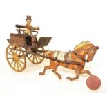 A Hubley Toys early 20th century cast iron model of a horse drawn wagon, comprising of brown horse