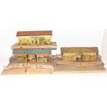 One tray containing a quantity of various 0 gauge lineside accessories and station buildings,