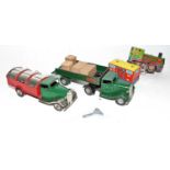 A small group of 2 Minic tinplate trucks, delivery truck and dustcart and a tinplate train with